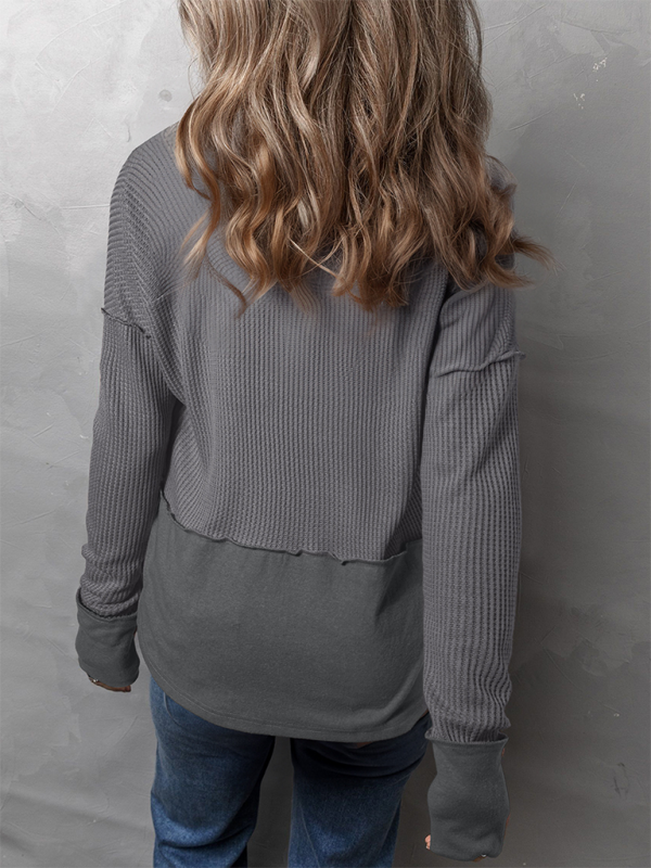 Gray waffle-knit long-sleeve shirt showcasing a solid color casual clothing style