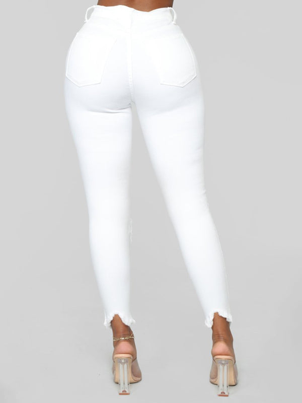 Women’s elastic ripped solid color denim long trousers