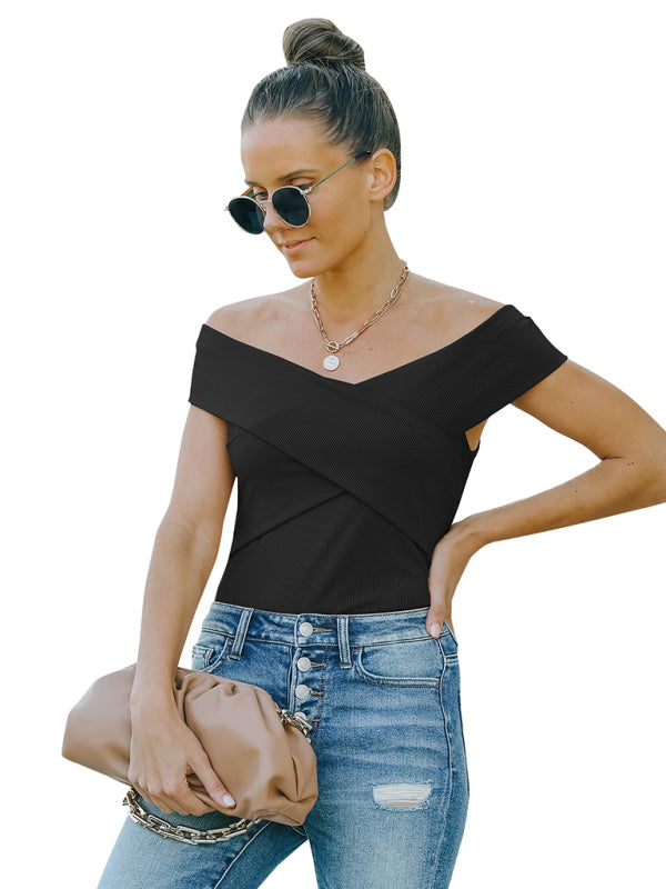 Woman in black crossover top with slight elasticity and fashion skinny jeans